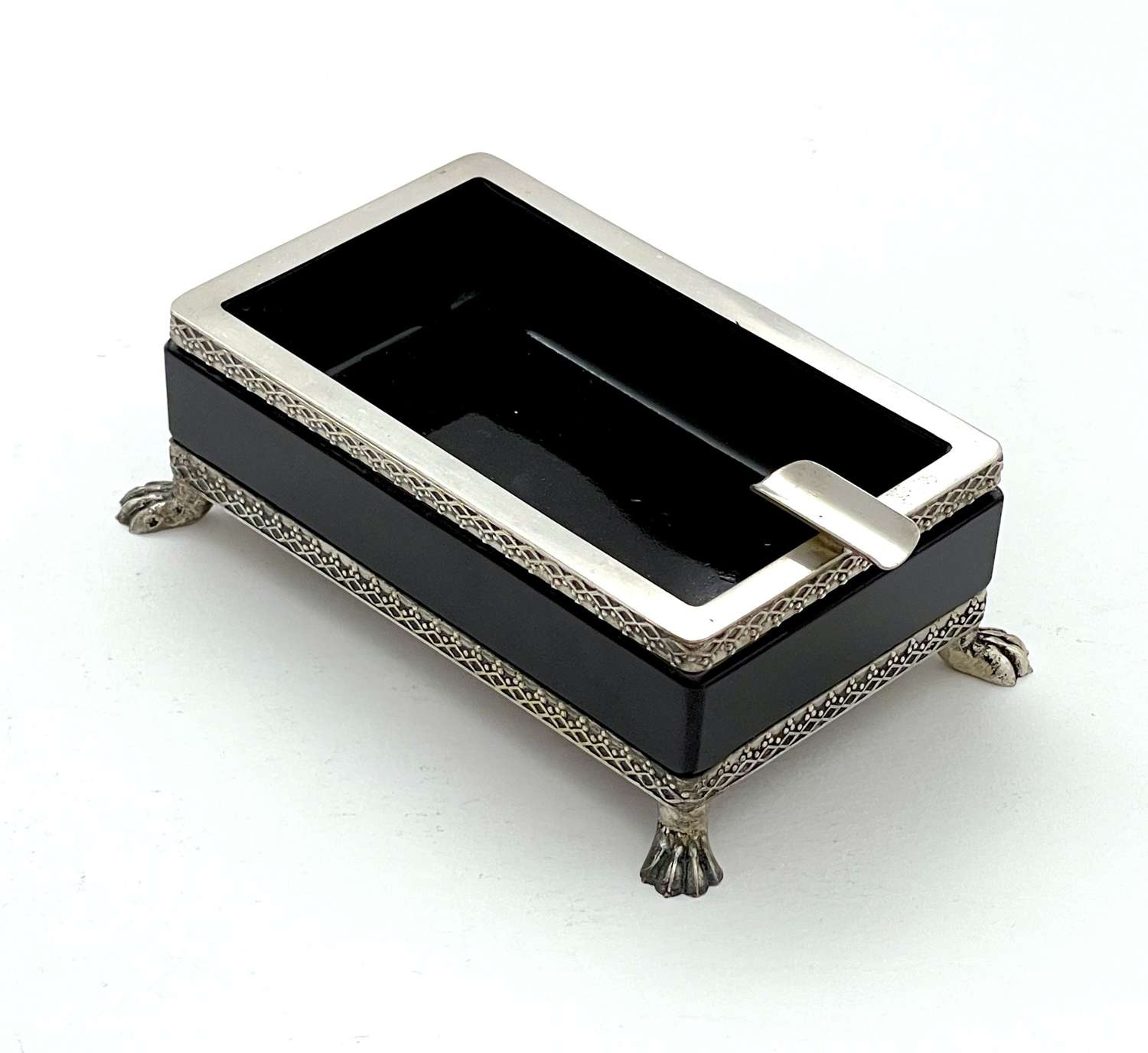 A Vintage Black Opaline Glass Ashtray with 4 'Silver' Feet.