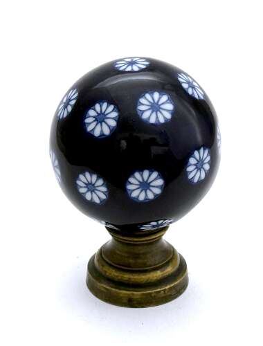 An Antique Blue and White Overlay Boule D'Escalier with Pretty Flower Design