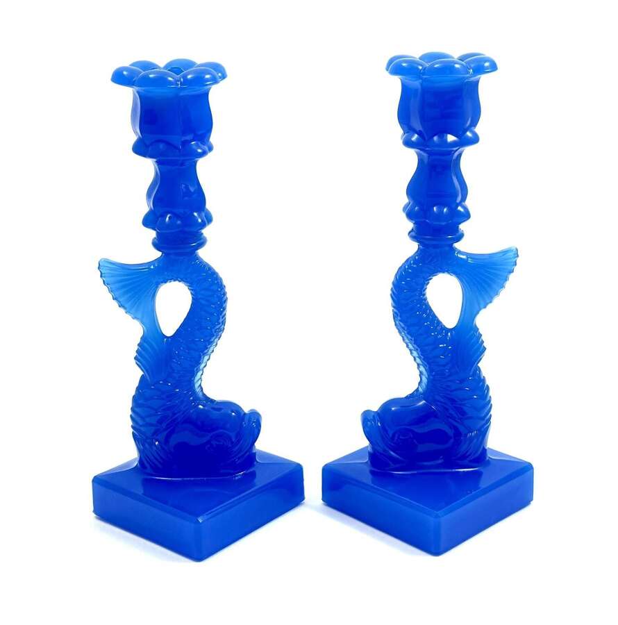 A Pair of Antique Baccarat Blue&nbsp;Opaline Glass&nbsp;'Turn-Tail' Dolphin Candlesticks.