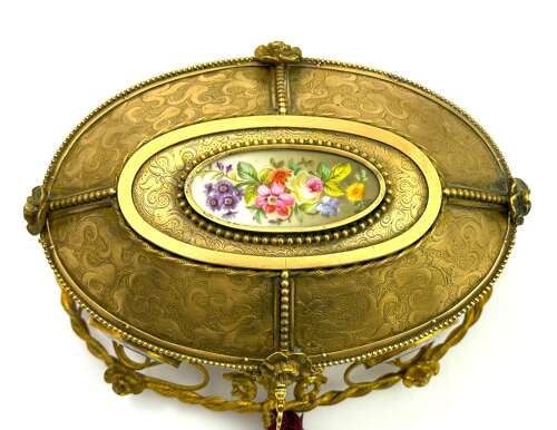A Large Antique French Dore Bronze Casket with Porcelain Plaques and Cherub Lock